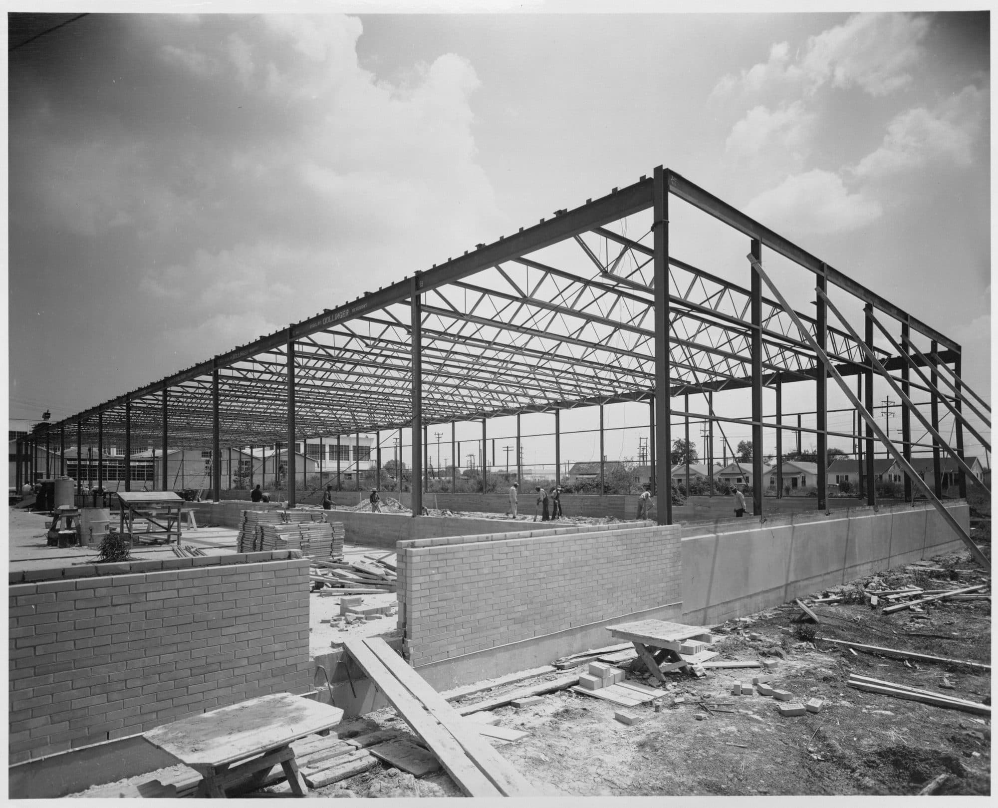 Steel mezzanine floor structure with primary beams and columns inside a warehouse