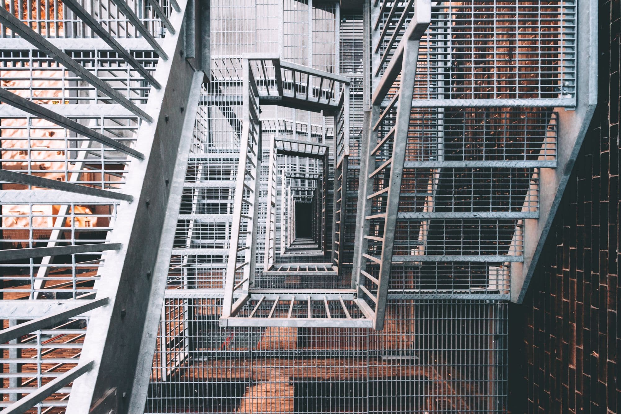 Fabricated commercial steel staircase with steel balustrade in a building interior